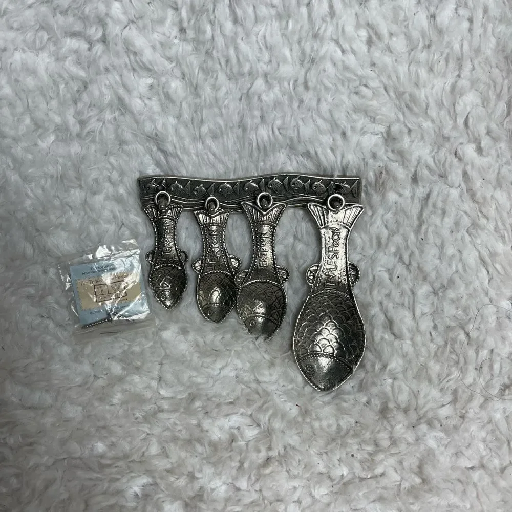 Vintage Tin Woodsman TWpewter set of four Fish measuring spoons with wall hanger